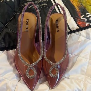 Clear, pink sling back heels with crystal details. Size 7 wide.